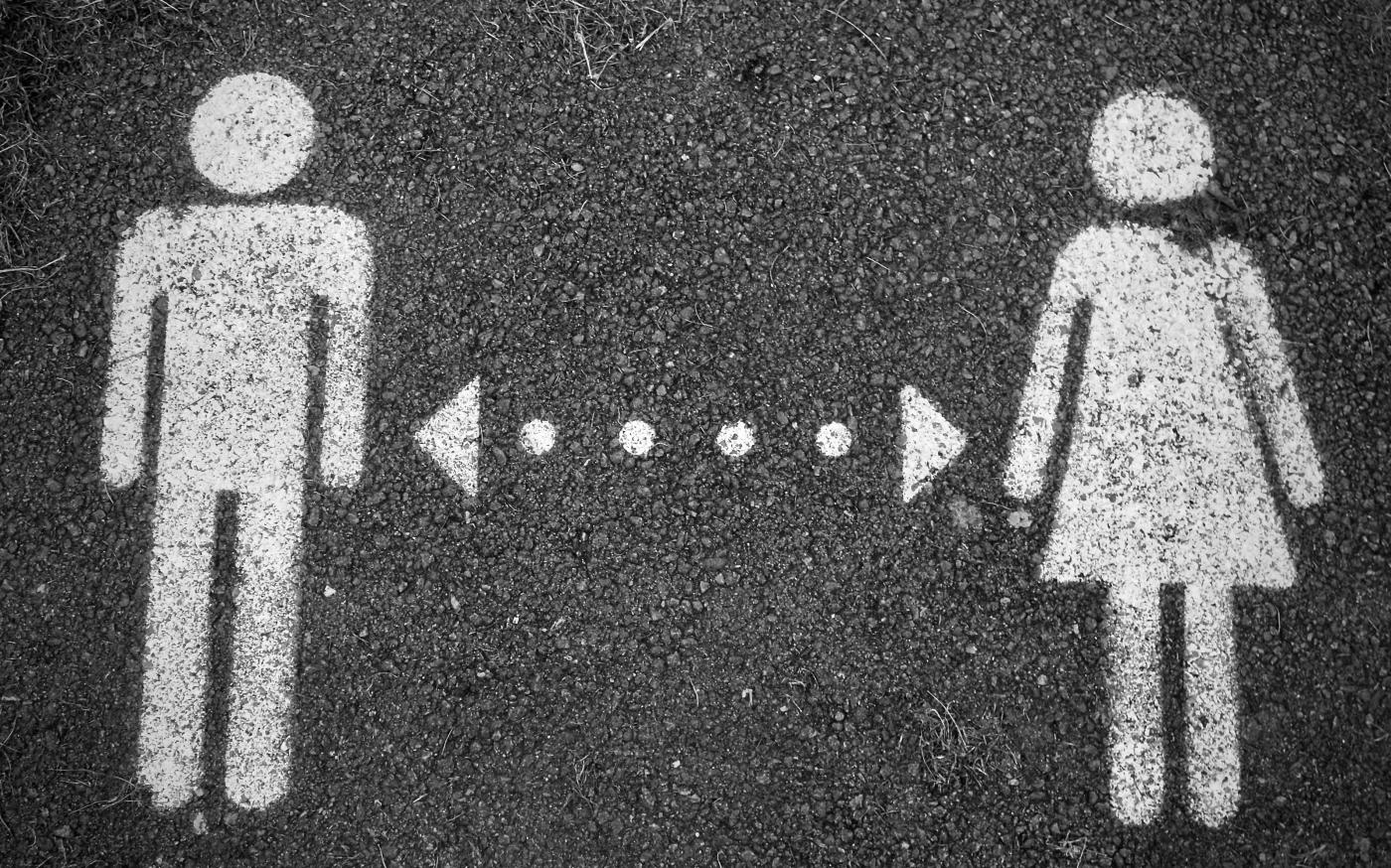 a couple of people standing next to each other by Pea courtesy of Unsplash.