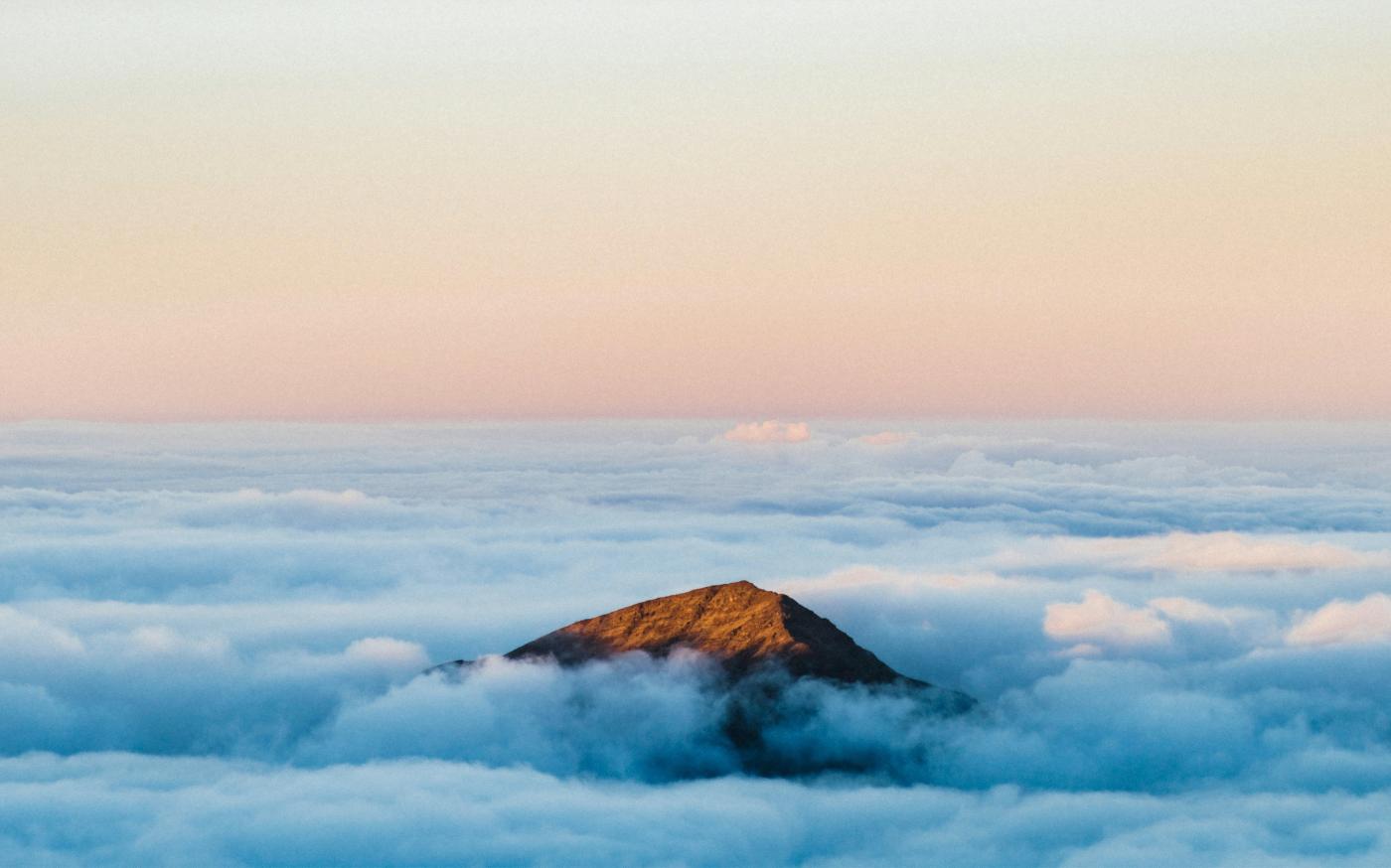 brown mountain under white clouds during daytime by Luke Richardson courtesy of Unsplash.