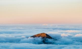 brown mountain under white clouds during daytime by Luke Richardson courtesy of Unsplash.