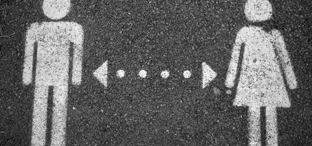 a couple of people standing next to each other by Pea courtesy of Unsplash.