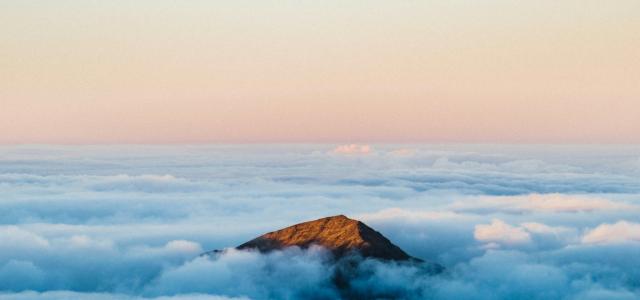 brown mountain under white clouds during daytime by Luke Richardson courtesy of Unsplash.